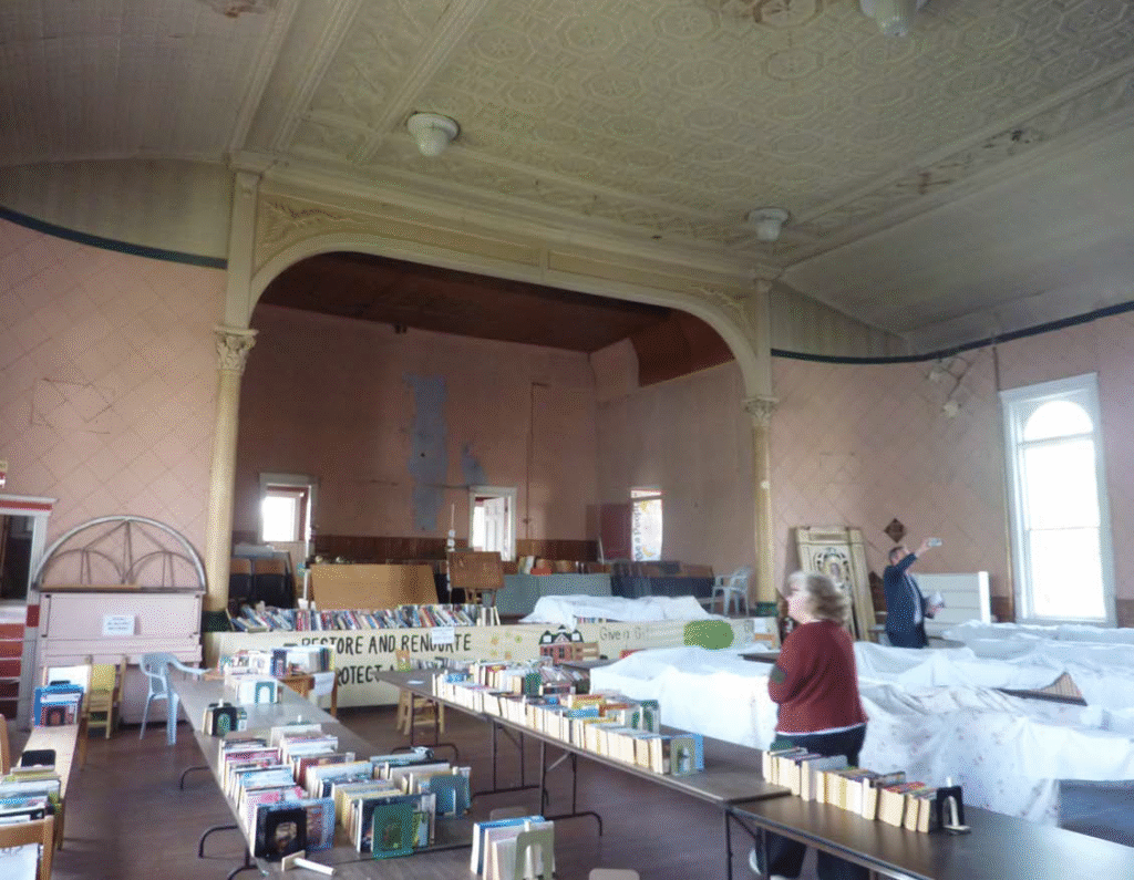 Before image, showing the upstairs looking as it exists today -- dingy, peeling and in need of love.